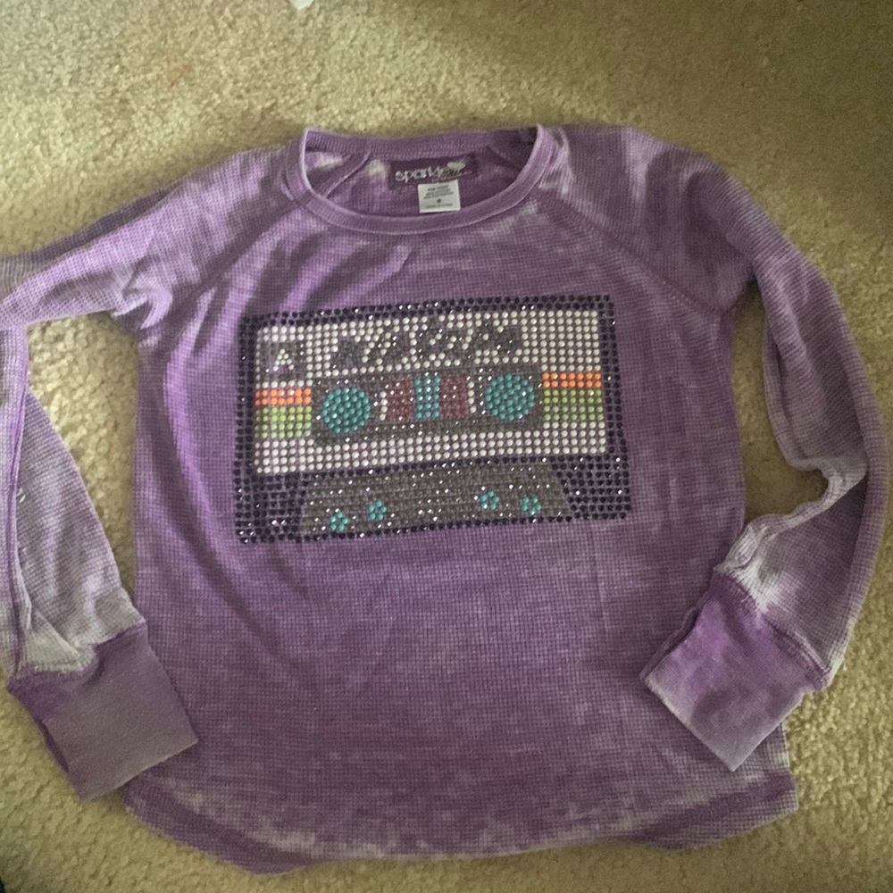 A started top designed like a cassette tape